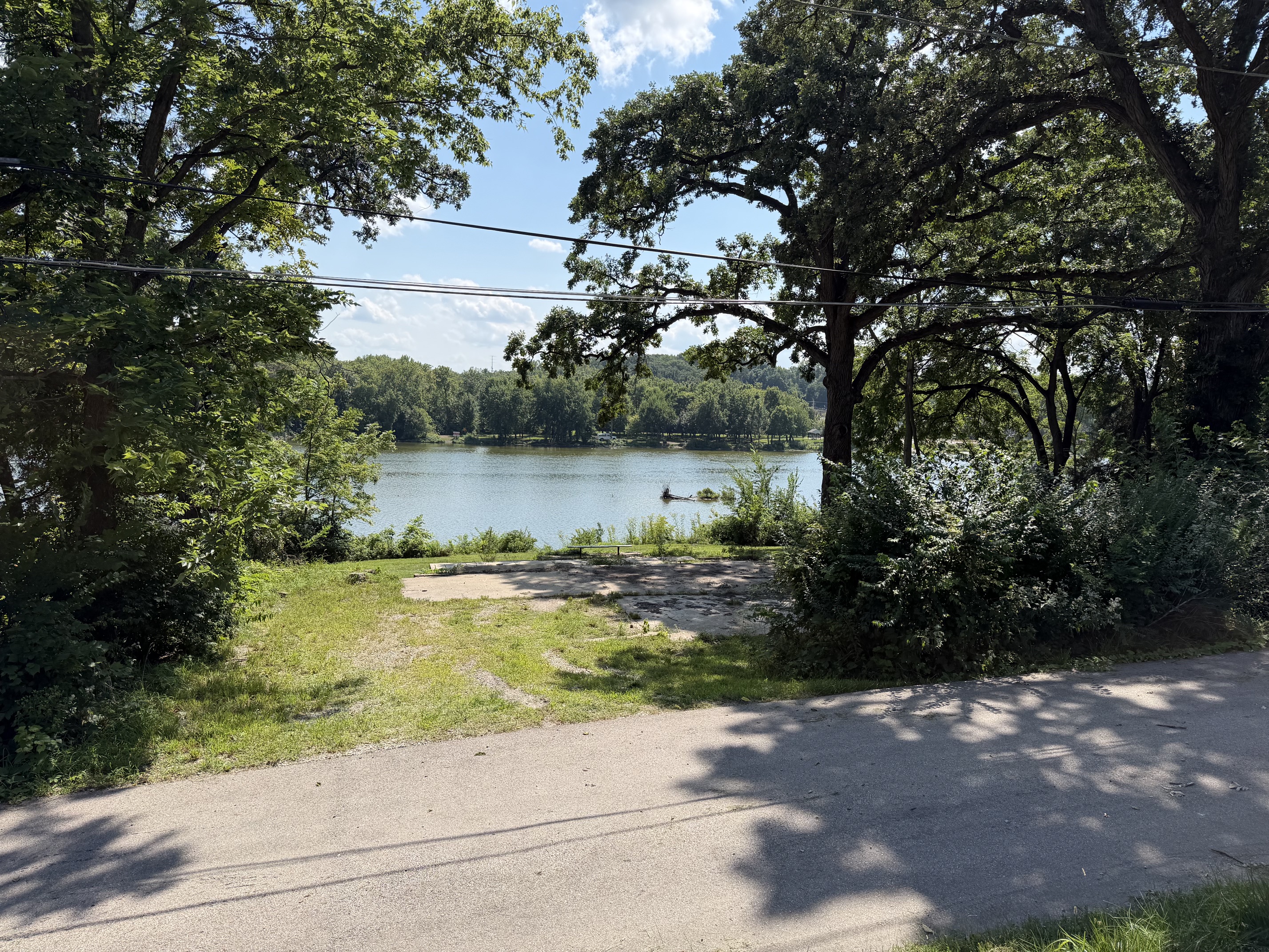 PIN 02-33-129-004. Fox River homesite at 102 Worsley Street. Concrete pad, road in front, river behind.